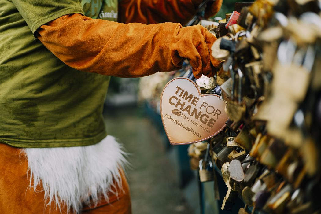 Campaigner with padlock on Bakewell Bridge