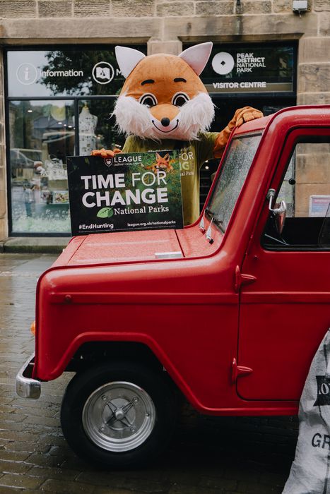 A League campaigner in fox costume with Postman Pat van
