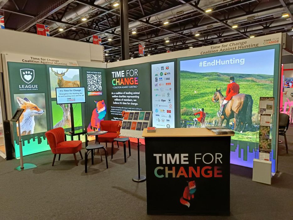 The League's L-shaped exhibition stand with table and chairs